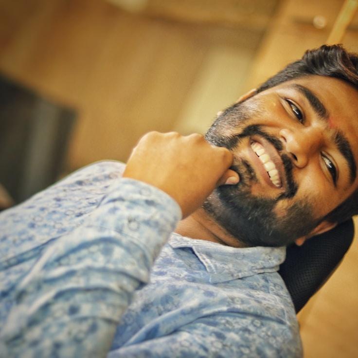 Avery Singh, Lead Design Curator at GardenRidgeCraft, reviewing corporate floral arrangements